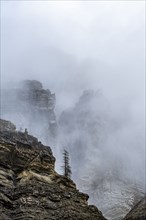 Cliffs in fog in Dolomites, Italy