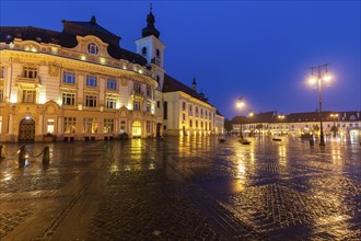 Wet Grand Square at sunset in Sibiu