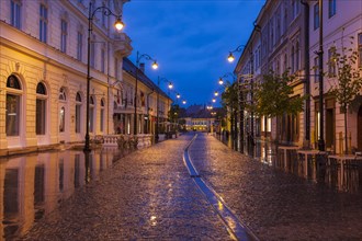 Wet street at sunset in Sibiu