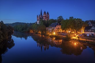 Limburg Cathedral by river at night in Limburg