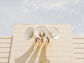 Three loudspeakers on wall