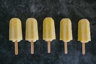 Row of lemon ice pops
