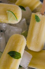 Lemon ice pops with mint and lime