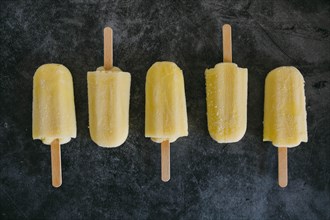 Row of lemon ice pops