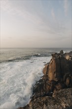 Cliff by sea at sunset in Peniche