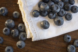 Blueberries on white fabric