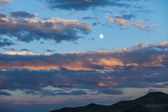 Sunset cloudscape with full moon in Picabo