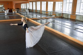 Ballet dancer practicing in studio