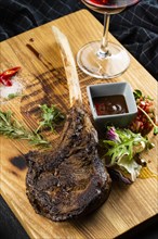Rib steak on cutting board