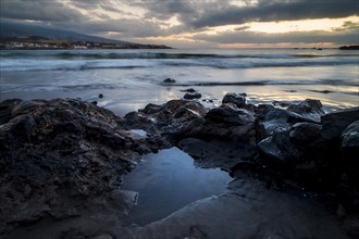 Rocks on beach at sunset in Tenerife
