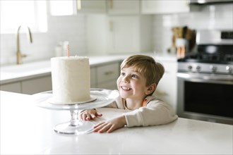 Boy smiling at birthday cake