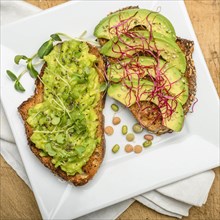 Avocado and bean sprouts on toast