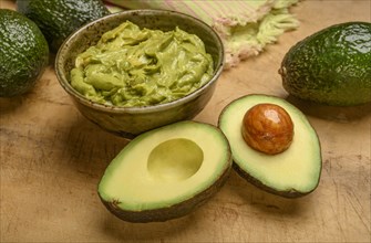 Bowl of guacamole with avocados