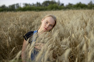 Young woman in wheat field