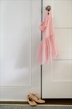 Pink ballet tutu hanging on doorknob