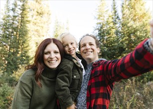 Family selfie in forest