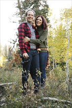 Couple smiling in forest