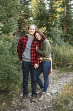 Couple smiling in forest
