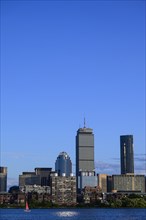 City skyline with boat on Charles River in Boston, Massachusetts, USA