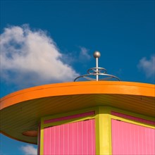 Pink and orange beach hut against sky in Miami, Florida, USA