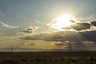 Sunbeams over field in Boise, Idaho, USA
