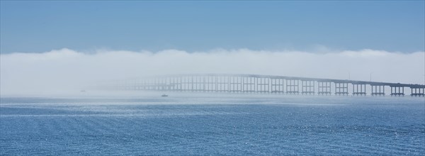 Bridge over sea in fog in Key Biscayne, Florida, USA