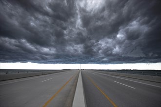 Road under stormy sky