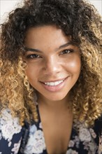 Smiling woman with curly hair