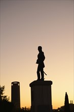 Silhouette of statue at sunset in Seville, Spain