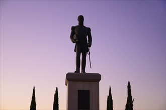 Silhouette of statue at sunset in Seville, Spain