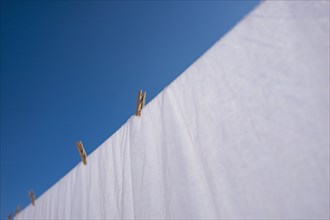 Pegs and sheet on washing line