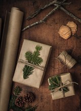 Pine fronds tied to Christmas presents