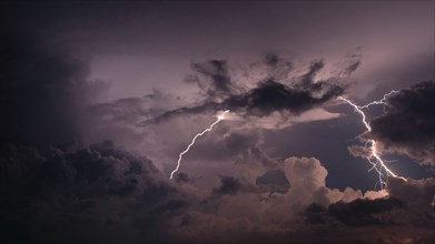 Lightning and storm clouds in sky
