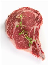Raw steak and oregano
