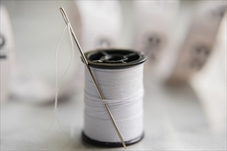 White thread and needle