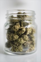 Glass jar filled with marijuana