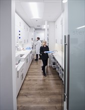 Dentist and assistant in sterilization room