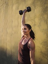 Woman weightlifting with dumbbells