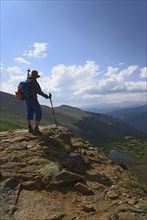 Woman admiring view while hiking on Berthoud Pass Trail in Colorado