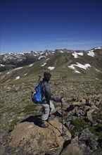 Woman looking at view while hiking in Loveland Pass, Colorado
