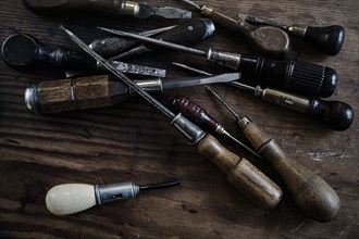 Variety of screwdrivers on wooden table