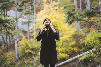 young woman in autumn forest