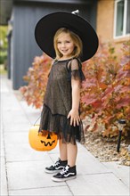 Girl in witch costume for Halloween