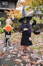 Boy and girl in Halloween costumes