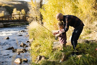 Father and son fishing together