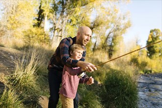 Father and son fishing together