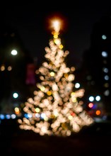 Defocussed Christmas tree illuminated at night