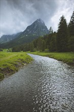 River by mountain in ybersee, Switzerland