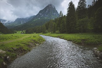 River by mountain in ybersee, Switzerland