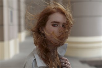 young woman with windblown hair